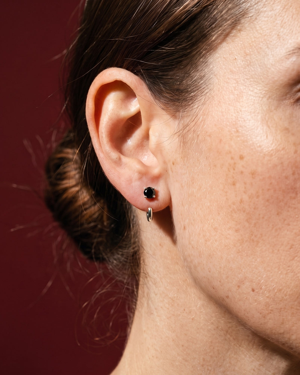 Black Round Open Hoop in Sterling Silver, worn on the ear