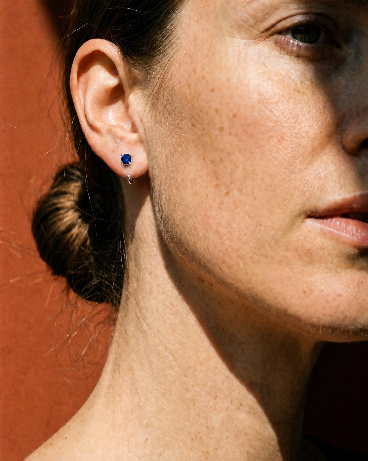 Blue Round Open Hoop in Sterling Silver, worn on the ear