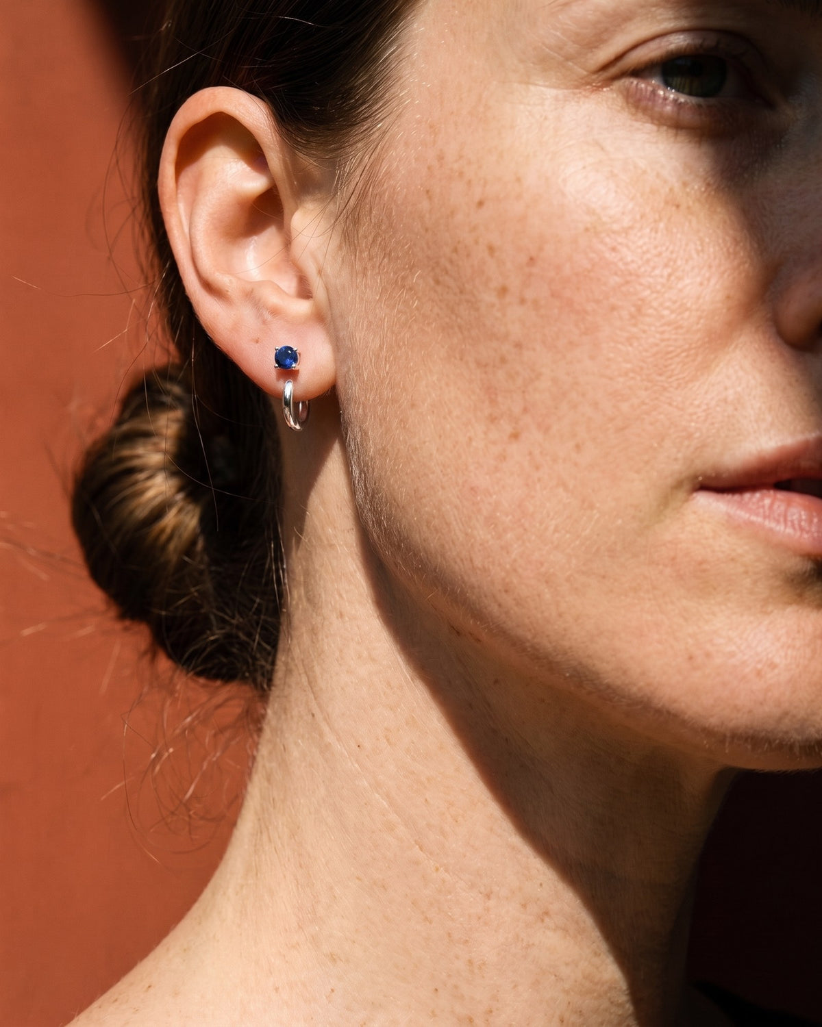 Blue Round Open Hoop in Sterling Silver, worn on the ear