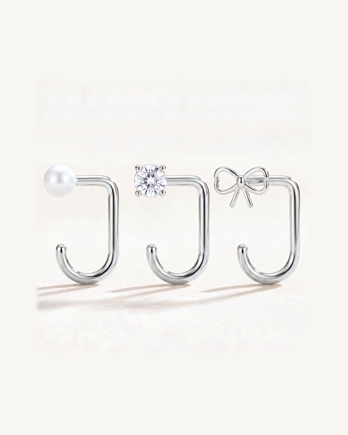 Bow, Clear Round and White Bead, Sterling Silver, the three pieces side by side