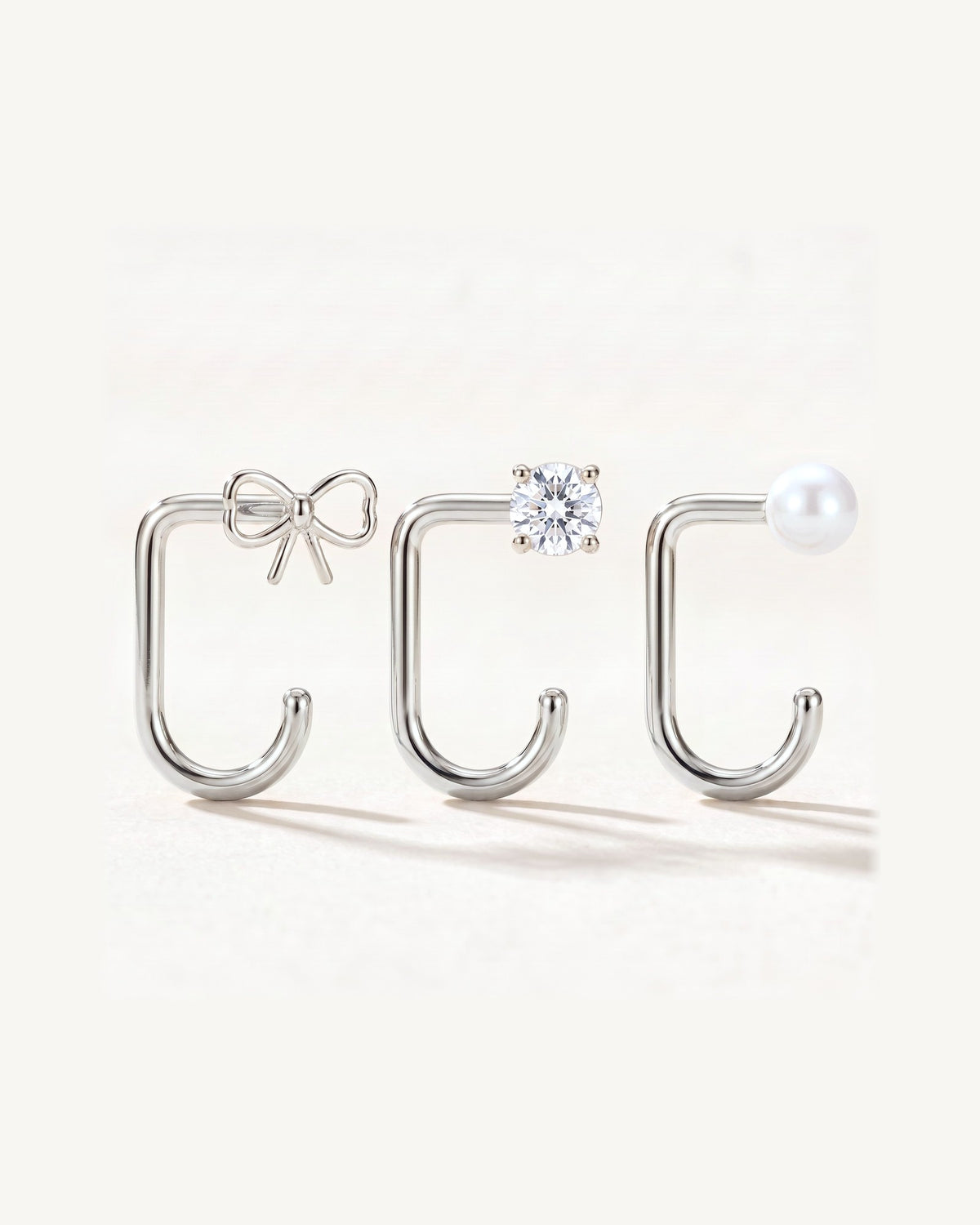 Bow, Clear Round and White Bead, Sterling Silver, the three pieces side by side