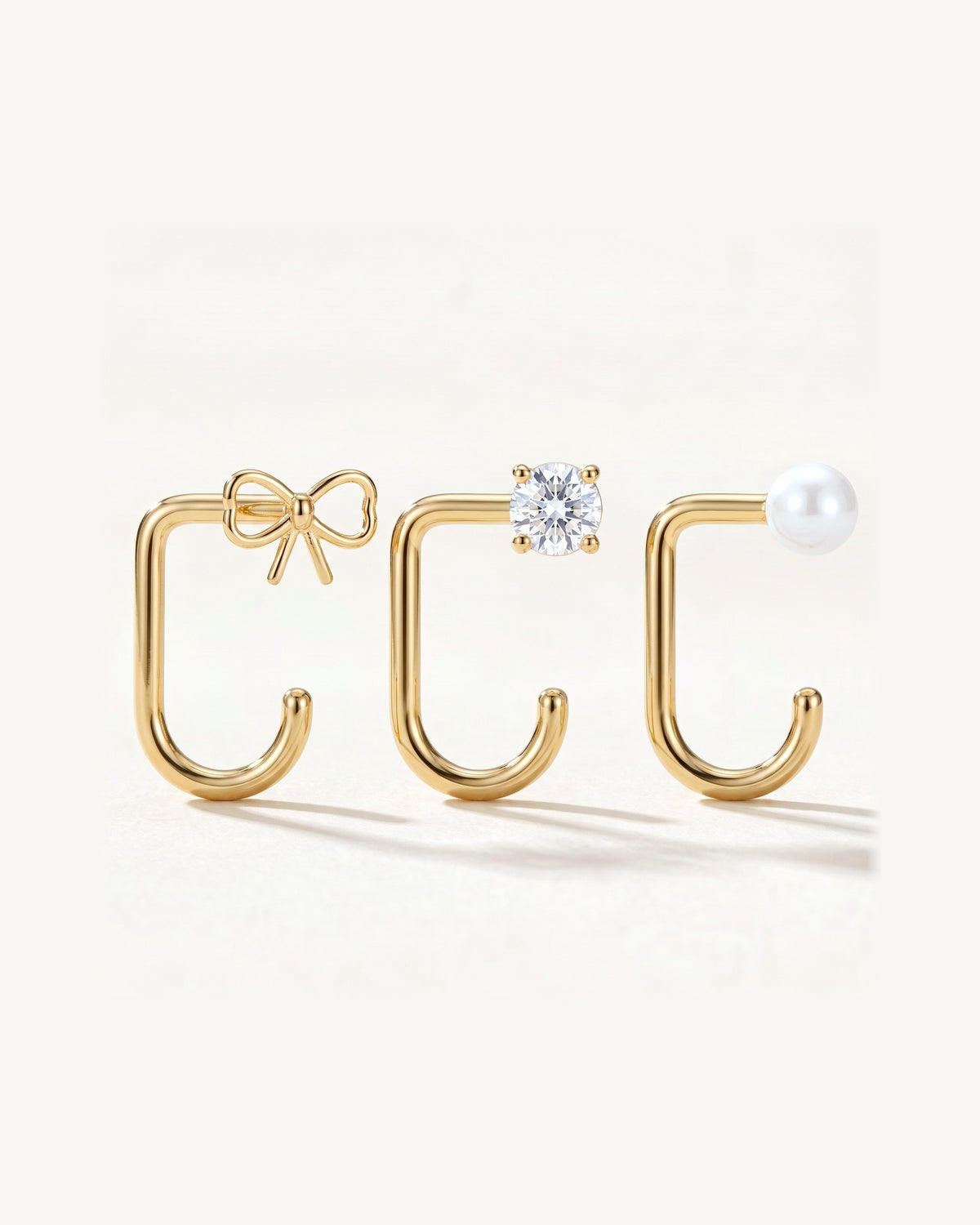 Bow, Clear Round and White Bead, 18K Gold Vermeil, the three pieces side by side