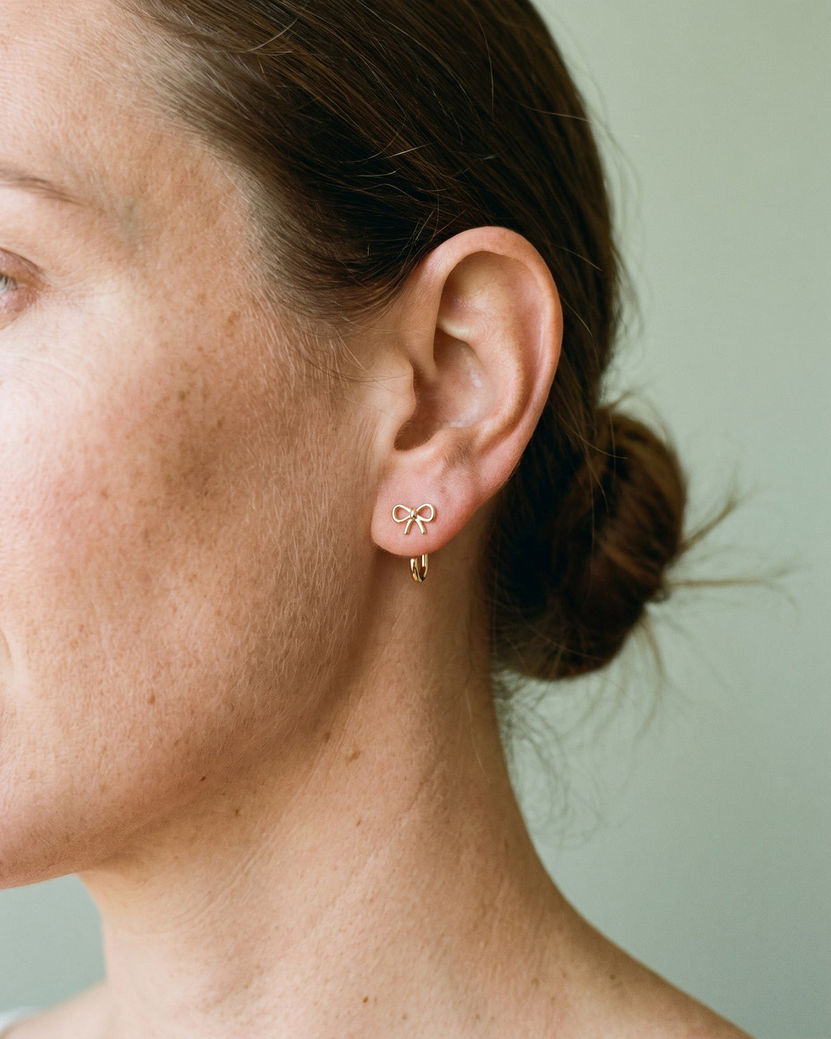 Bow Open Hoop in 18K Gold Vermeil, worn on the ear