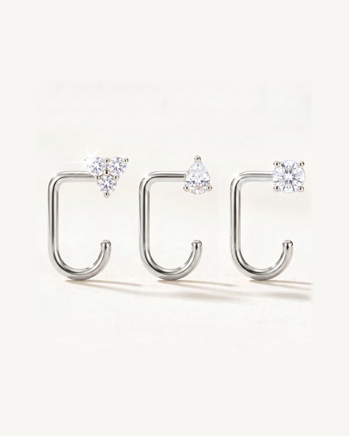 Clear Cluster, Teardrop and Round, Sterling Silver, the three pieces side by side
