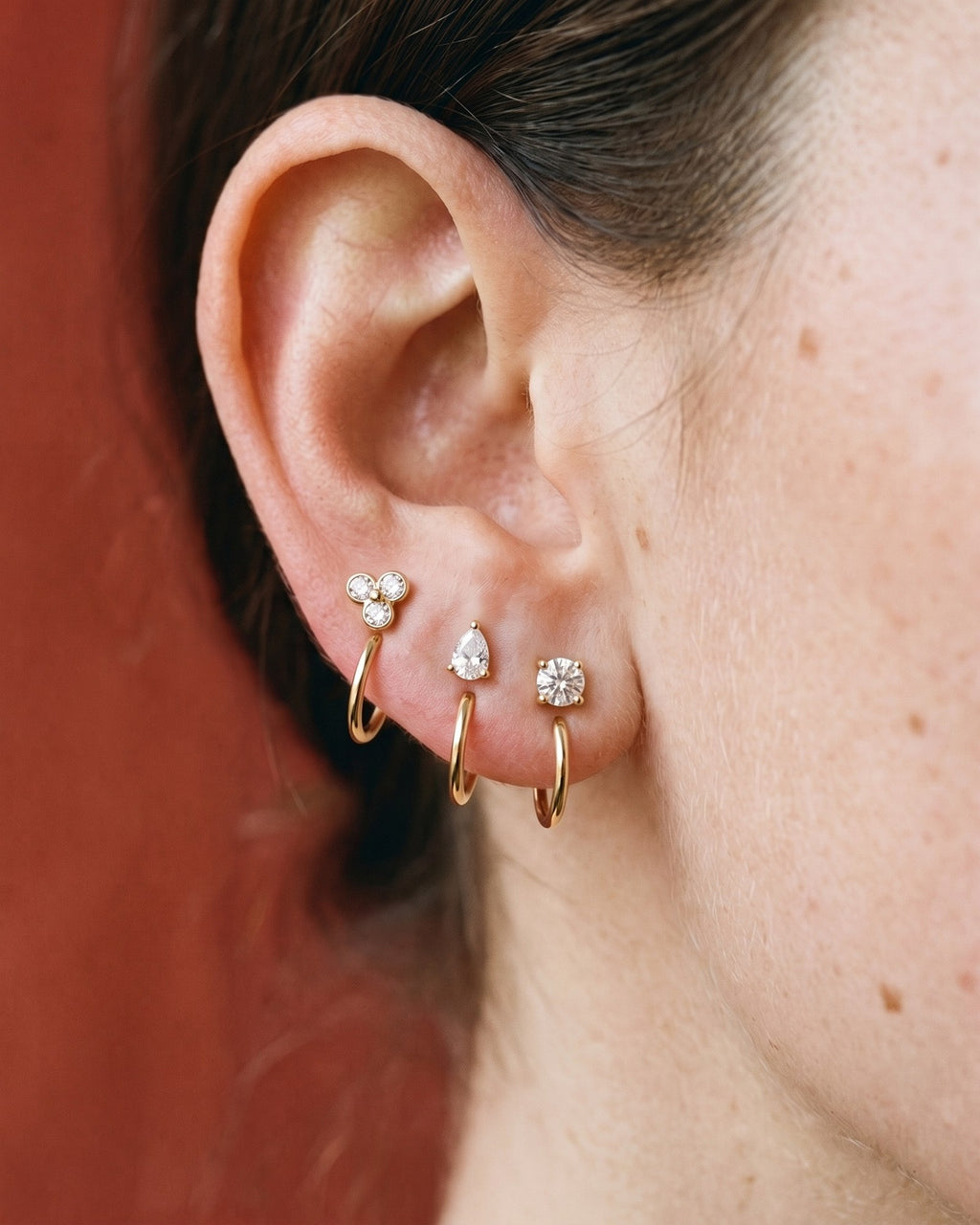 The Clear Cluster, Teardrop and Round set in 18K Gold Vermeil, worn on one ear