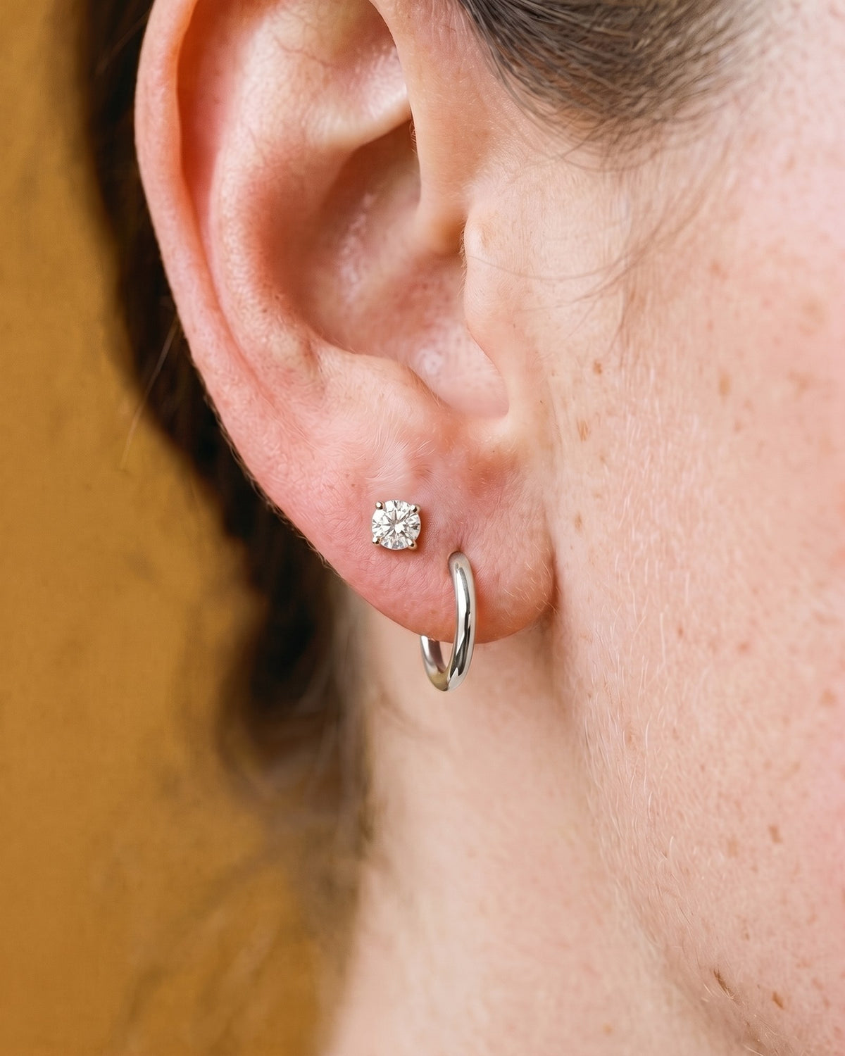 Clear Round Open Hoop in Sterling Silver, worn on the ear