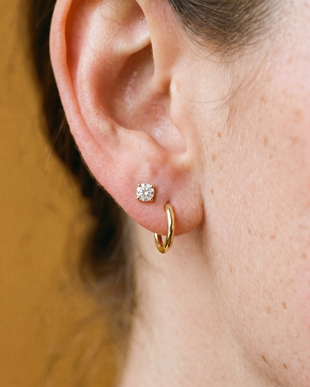 Clear Round Open Hoop in 18K Gold Vermeil, worn on the ear