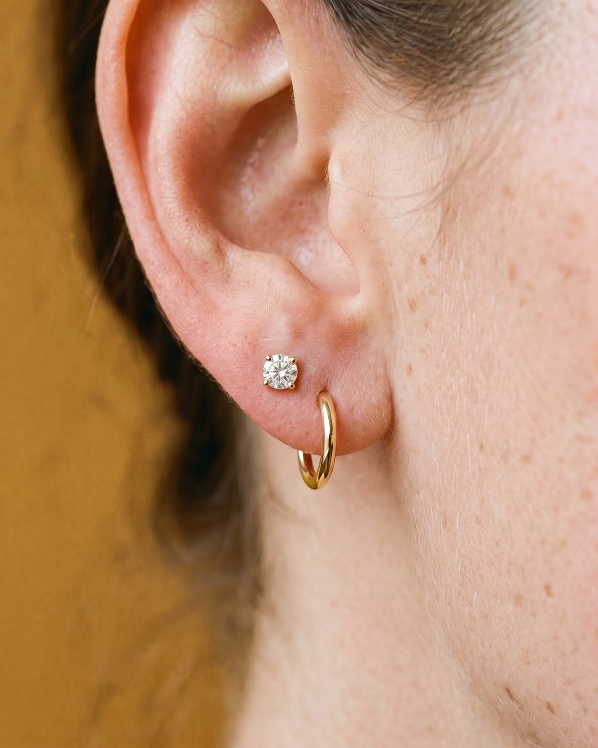 Clear Round Open Hoop in 18K Gold Vermeil, worn on the ear