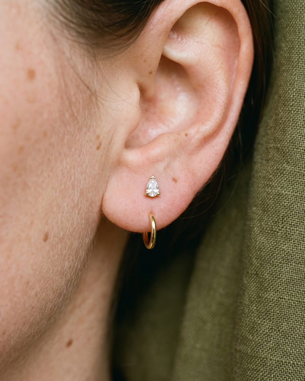 Clear Teardrop Open Hoop in 18K Gold Vermeil, worn on the ear
