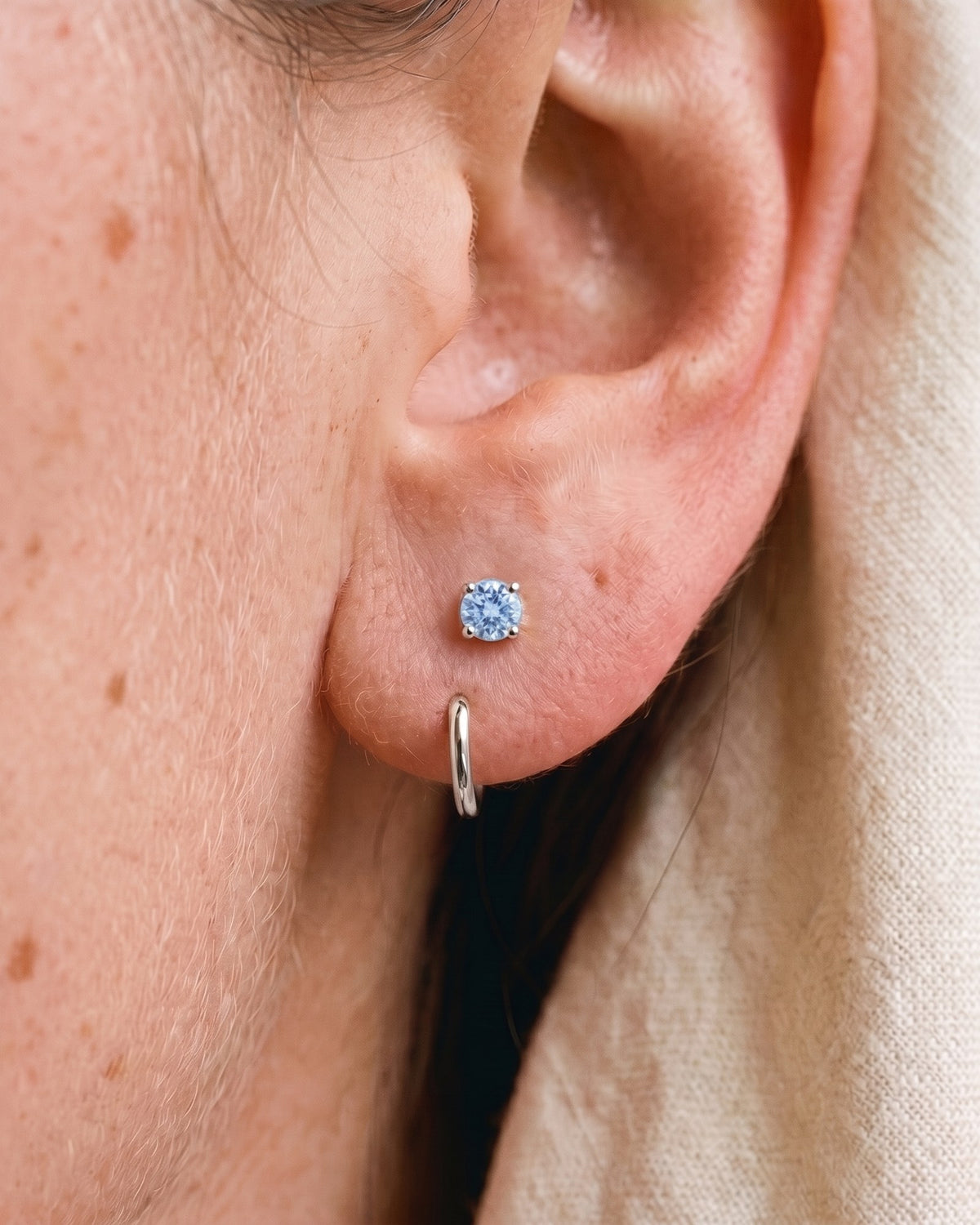 Light Blue Round Open Hoop in Sterling Silver, worn on the ear