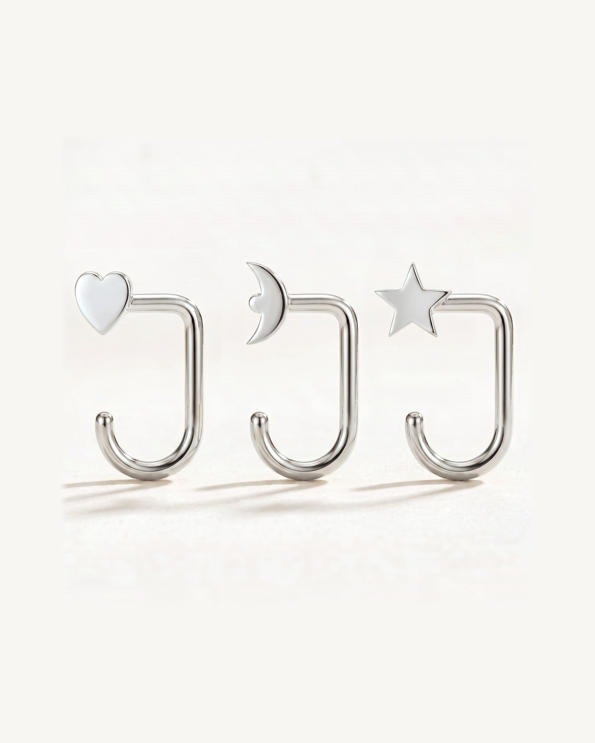 Star, Crescent and Heart, Sterling Silver, the three pieces side by side