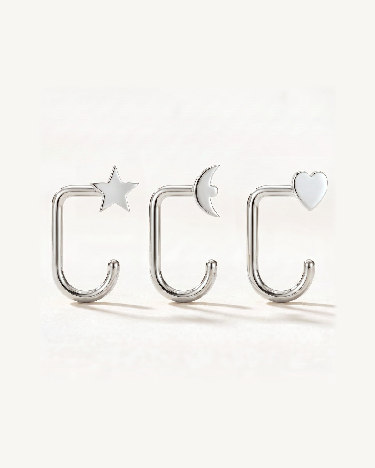 Star, Crescent and Heart, Sterling Silver, the three pieces side by side