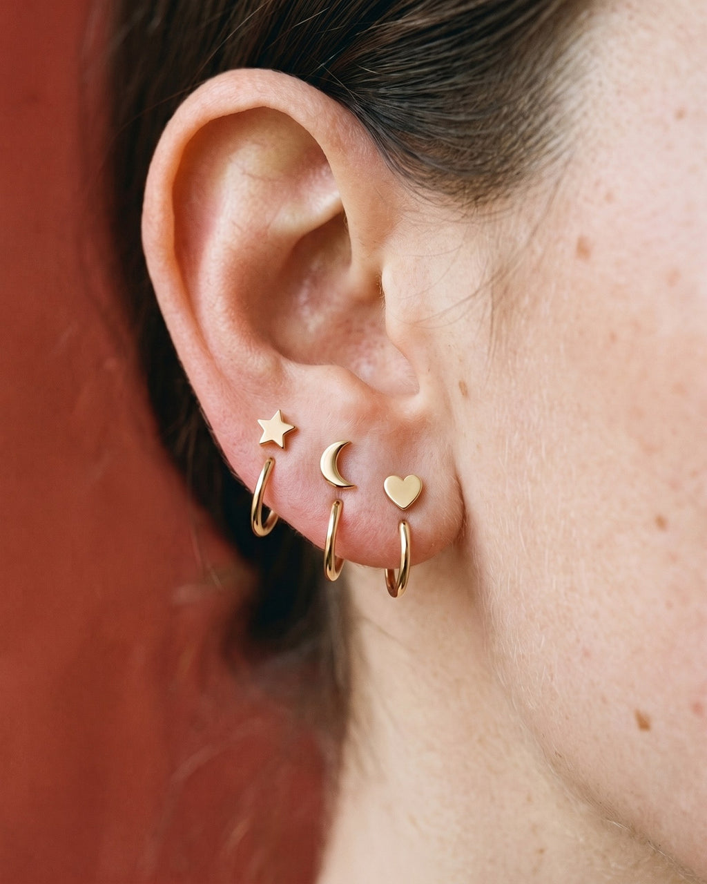 The Star, Crescent and Heart set in 18K Gold Vermeil, worn on one ear