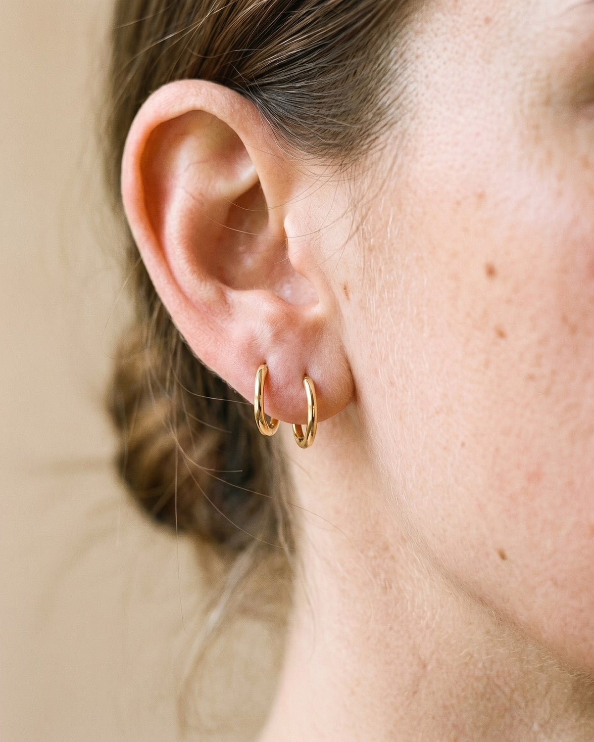 Two Plain Huggies in 18K Gold Vermeil, worn on the ear